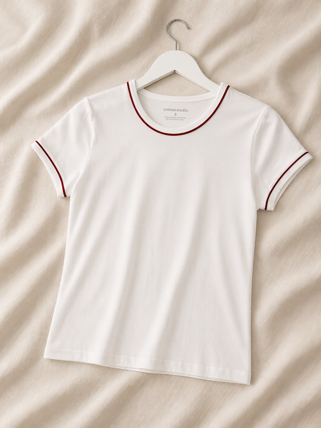 White top with red stripe